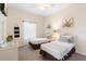 Charming bedroom featuring twin beds, a ceiling fan, and neutral walls adorned with decorative art at 607 Gran Bahama Blvd # B29/U607, Davenport, FL 33897
