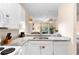 Open kitchen featuring granite countertops, stainless steel sink, and view to the living area at 607 Gran Bahama Blvd # B29/U607, Davenport, FL 33897