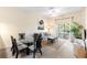 Comfortable living room features a dining table, ceiling fan and sliding glass door to the outside at 607 Gran Bahama Blvd # B29/U607, Davenport, FL 33897