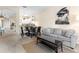 Open-concept living room showcases a sofa, stylish coffee table, and serene decor with access to dining area at 607 Gran Bahama Blvd # B29/U607, Davenport, FL 33897