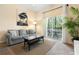 Inviting living room features access to screened-in porch, comfortable sofa, and stylish coffee table at 607 Gran Bahama Blvd # B29/U607, Davenport, FL 33897