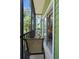 Relaxing screened porch with comfortable seating and serene views of lush greenery and blue skies at 607 Gran Bahama Blvd # B29/U607, Davenport, FL 33897