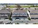 Aerial view of townhomes featuring solar panels, garages and a waterfront view at 6501 Cyrils Dr, St Cloud, FL 34771