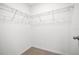 Walk-in closet with carpet and wire shelving ready for organization at 6501 Cyrils Dr, St Cloud, FL 34771