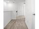 Upstairs hallway with neutral carpet, white walls, and doors with brushed bronze handles at 6501 Cyrils Dr, St Cloud, FL 34771