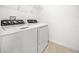 Laundry room featuring a large washing machine and dryer at 6501 Cyrils Dr, St Cloud, FL 34771