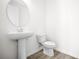 Stylish powder room featuring a pedestal sink, decorative faucet, and tiled flooring at 6501 Cyrils Dr, St Cloud, FL 34771