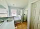 Bathroom featuring a soaking tub, walk-in shower, tile floors, and a vanity with sink at 664 Eagle Pointe S, Kissimmee, FL 34746