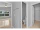 Hallway view into the hall bathroom and primary bedroom at 664 Eagle Pointe S, Kissimmee, FL 34746