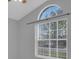 Bedroom featuring a large window with vertical blinds, letting in natural light and offering a view at 664 Eagle Pointe S, Kissimmee, FL 34746