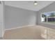 Spacious bedroom with tiled floors and a window offering lots of natural light at 664 Eagle Pointe S, Kissimmee, FL 34746