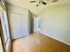 Comfortable bedroom featuring tile flooring, closet, and natural light from a window at 664 Eagle Pointe S, Kissimmee, FL 34746