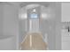 Bright entryway featuring neutral tile floors and a decorative design, leading to the front door at 664 Eagle Pointe S, Kissimmee, FL 34746