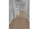 Spacious hallway featuring tile flooring, neutral walls, and archways leading to other rooms at 664 Eagle Pointe S, Kissimmee, FL 34746