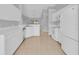 Stylish kitchen equipped with all-white appliances, ample counter space, and a functional layout for easy meal preparation at 664 Eagle Pointe S, Kissimmee, FL 34746