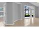 Cozy living room features a sliding glass door, a window, and tiled floors at 664 Eagle Pointe S, Kissimmee, FL 34746