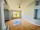 Bright living room with tile floors, large windows, and a ceiling fan at 664 Eagle Pointe S, Kissimmee, FL 34746
