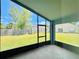 Relaxing screened porch overlooking the backyard and fenced in lawn at 664 Eagle Pointe S, Kissimmee, FL 34746