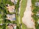 High-angle view of stunning properties adjacent to a golf course, boasting private pools and meticulous landscaping at 6761 Valhalla Way, Windermere, FL 34786