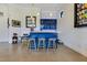 Stylish bar area featuring a blue counter, seating, and a beverage center at 6761 Valhalla Way, Windermere, FL 34786