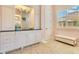 Bathroom boasts custom vanity with granite countertops, decorative mirror, and unique wood patterned floors at 6761 Valhalla Way, Windermere, FL 34786