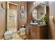 Traditional bathroom featuring octagon mirror, vanity, tile floors, and glass shower at 6761 Valhalla Way, Windermere, FL 34786
