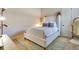 Cozy bedroom with a comfortable queen-sized bed, plush rug, and ample natural light at 6761 Valhalla Way, Windermere, FL 34786
