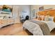 Comfortable bedroom featuring natural light, wooden headboard, and work desk at 6761 Valhalla Way, Windermere, FL 34786