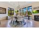 Light dining area includes round table, modern lighting, and large windows with outdoor views at 6761 Valhalla Way, Windermere, FL 34786