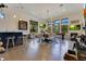 Open-concept dining area with bar, views, modern lighting, and games at 6761 Valhalla Way, Windermere, FL 34786