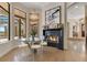 Cozy dining area featuring a fireplace and a view of the patio at 6761 Valhalla Way, Windermere, FL 34786