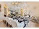 Formal dining room with seating for eight and designer light fixtures at 6761 Valhalla Way, Windermere, FL 34786