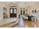 Elegant dining room featuring modern lighting, hardwood floors, and large windows at 6761 Valhalla Way, Windermere, FL 34786