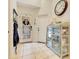 Inviting foyer with natural light, tile flooring, and decorative accents for a warm welcome at 6761 Valhalla Way, Windermere, FL 34786