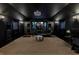 Spacious home theater with a projector, workout equipment, and top-of-the-line sound system at 6761 Valhalla Way, Windermere, FL 34786