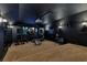 Home theater with projector, comfortable seating, workout equipment and sound system at 6761 Valhalla Way, Windermere, FL 34786