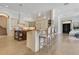 Well-designed kitchen with stainless steel appliances, island and bar seating, and lots of light at 6761 Valhalla Way, Windermere, FL 34786