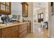 A large kitchen with custom cabinets overlooks the dining room at 6761 Valhalla Way, Windermere, FL 34786