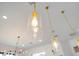 Contemporary lighting pendants with glass shades and brass finish at 6761 Valhalla Way, Windermere, FL 34786