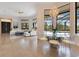 Open-concept living room features a dining area, large windows, and a view of the pool at 6761 Valhalla Way, Windermere, FL 34786