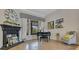 Elegant living room featuring a fireplace, piano and plenty of natural light at 6761 Valhalla Way, Windermere, FL 34786