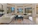 Comfortable living room with a large sectional sofa and views of the backyard pool at 6761 Valhalla Way, Windermere, FL 34786