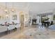 Bright, open concept living area with hardwood floors, modern lighting, and fireplace at 6761 Valhalla Way, Windermere, FL 34786