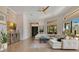Bright and airy living room with a brick accent wall and lots of natural light at 6761 Valhalla Way, Windermere, FL 34786