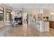 Open living space with a dining area, fireplace, and kitchen with bar seating at 6761 Valhalla Way, Windermere, FL 34786