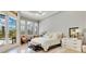 Open main bedroom features plantation shutters, hardwood floors, and private patio access at 6761 Valhalla Way, Windermere, FL 34786