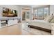 Bright main bedroom featuring hardwood floors, a sliding door and a view of the pool at 6761 Valhalla Way, Windermere, FL 34786