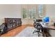 Bright office space with three windows, hardwood floors, and work desk at 6761 Valhalla Way, Windermere, FL 34786