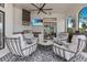Elegant outdoor living space featuring a grill, TV, fireplace, and comfortable seating at 6761 Valhalla Way, Windermere, FL 34786