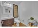 Elegant half bathroom featuring a modern vanity and stylish decorative elements at 6970 Piazza St, Orlando, FL 32819